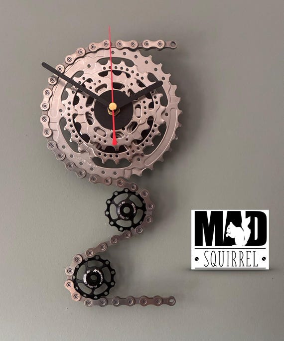 Triple Sprocket and Jockey Wheel Clock, depicting a bike derailleur and cassette, in Chrome and Small Black Face and Black and Red hands