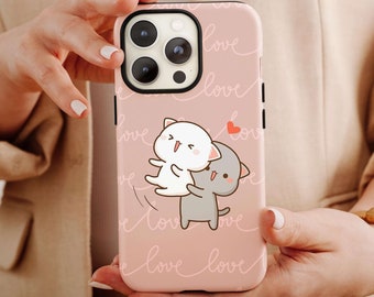 May include: A pink iPhone case featuring a white and grey cartoon cat design. The case is decorated with the word "love" repeated in a white cursive font.