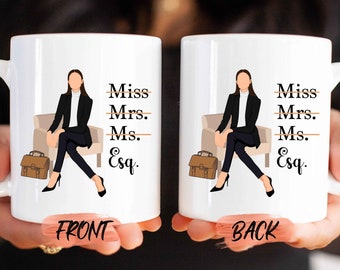 May include: White ceramic coffee mug with a black and white illustration of a woman sitting on a chair. The mug has the text "Miss Mrs. Ms. Esq." with lines through "Miss", "Mrs." and "Ms.". The mug is shown from the front and back.