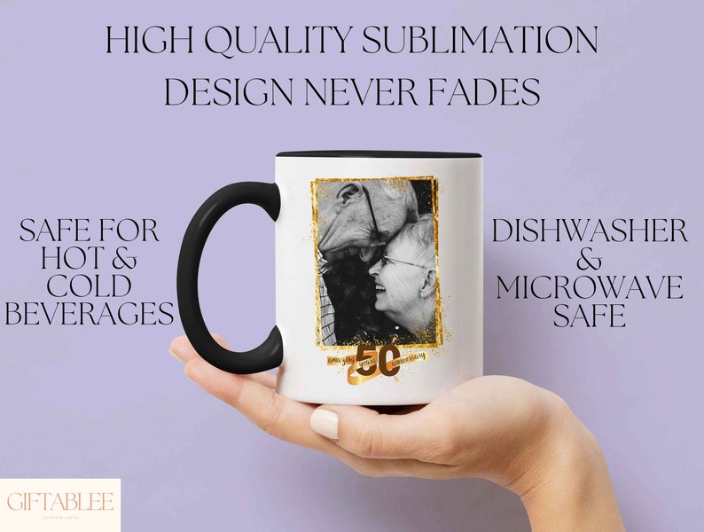 May include: White ceramic mug with a black handle. The mug features a black and white photo of a couple with the text "50th Anniversary" in gold lettering. The mug is dishwasher and microwave safe.