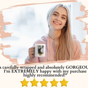 May include: A woman holding a white ceramic mug with a photo printed on it. The mug has a gold rim and the text "50" printed on it. The woman is smiling and looking at the camera. The text "It's carefully wrapped and absolutely GORGEOUS!!!! I'm EXTREMELY happy with my purchase highly recommended!" is printed below the image. Five yellow stars are displayed below the text.