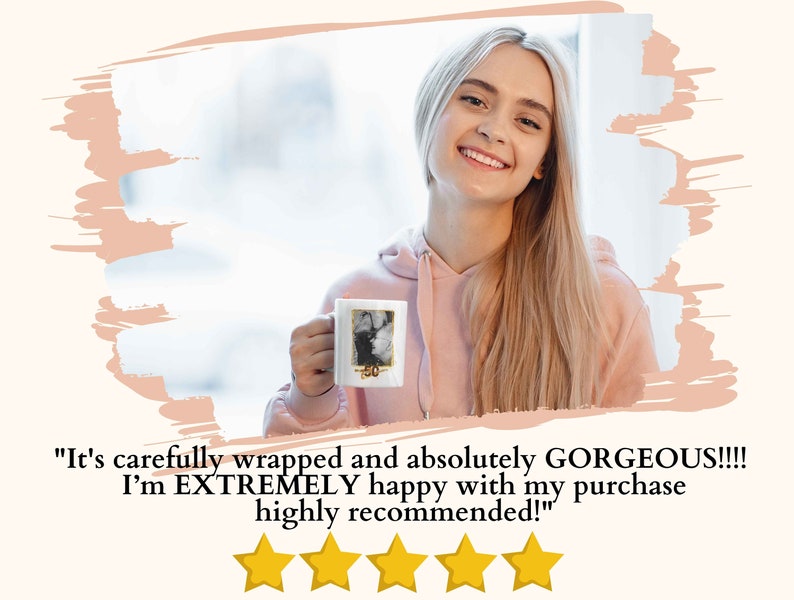 May include: A woman holding a white ceramic mug with a photo printed on it. The mug has a gold rim and the text "50" printed on it. The woman is smiling and looking at the camera. The text "It's carefully wrapped and absolutely GORGEOUS!!!! I'm EXTREMELY happy with my purchase highly recommended!" is printed below the image. Five yellow stars are displayed below the text.