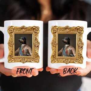 a person holding two coffee mugs with a picture of a dog