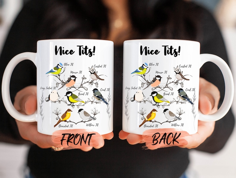 May include: White ceramic mug with a black outline of a tree branch with various birds on it. The text "Nice Tits!" is printed on the mug. The front of the mug shows the birds with their names, such as "Blue Tit", "Crested Tit", "Long Tailed Tit", "Great Tit", "Coal Tit", "Bearded Tit", and "Willow Tit". The back of the mug shows the same birds with their names.