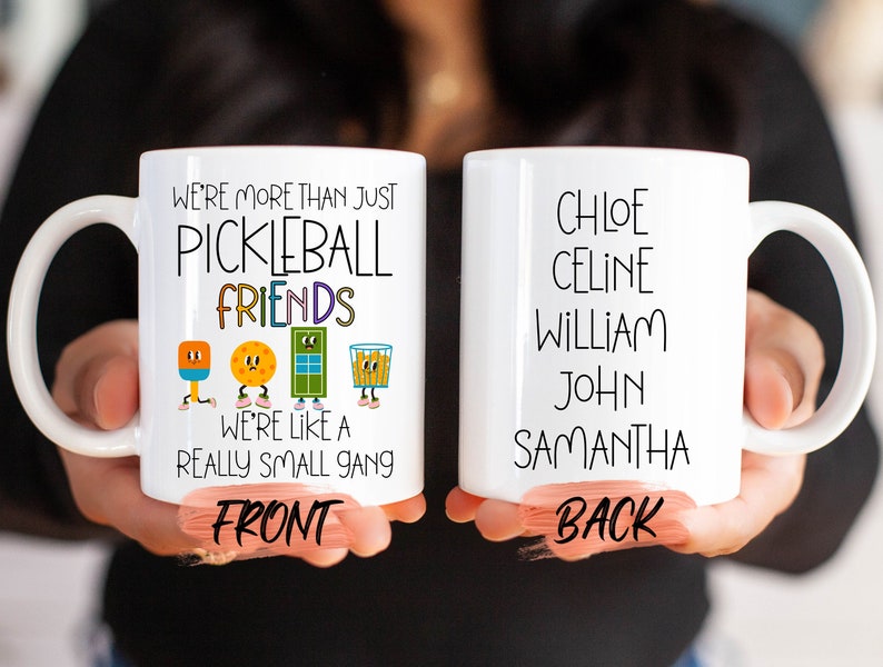 two white coffee mugs with words on them
