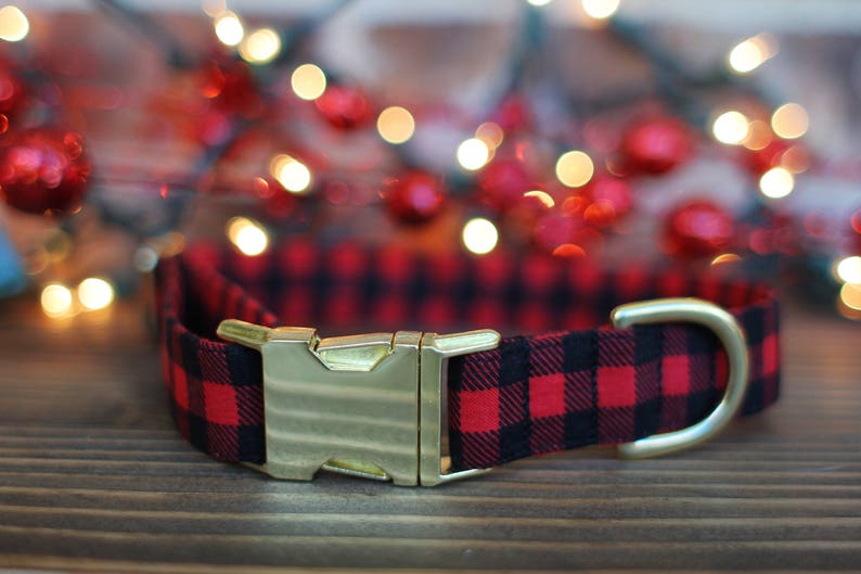 1/3 inch red and black buffalo plaid check with black on top and bottom for the 1 inch size with red square in the middle. Showing the D Ring and gold buckle