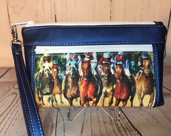 Blue metallic vinyl with thoroughbred racehorses wristlet. Zipper pouch with front zip pocket, double zipper wristlet, clutch, zipper pouch