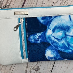 Wristlet purse with vertical front zip pocket, white faux leather, sea turtle theme, summer seaside vibe
