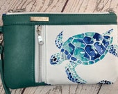 Wristlet purse with vertical front zip pocket, teal faux leather, sea turtle theme, summer seaside vibe