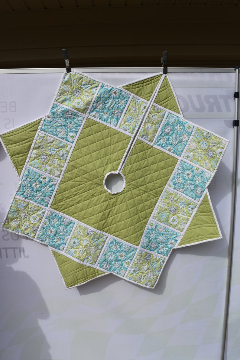Modern Christmas tree skirt in blues and greens