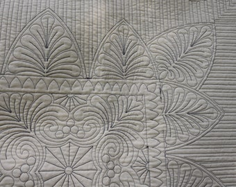Wholecloth custom throw quilt or wall hanging in ecru with navy stitching
