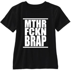 May include: Black t-shirt with white text that reads "MTHR FCKN BRAP" in a bold, blocky font.