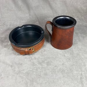 Beautiful set of 2 brown leather and black ceramic ashtrays Real Hide Made in England 1970’s