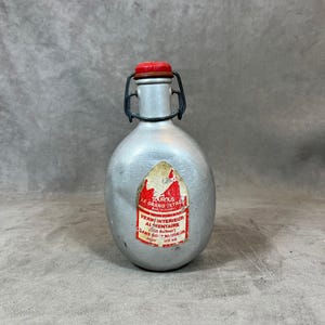 Gourde Le Grand Tétras rouge aluminium bouchon vintage 1