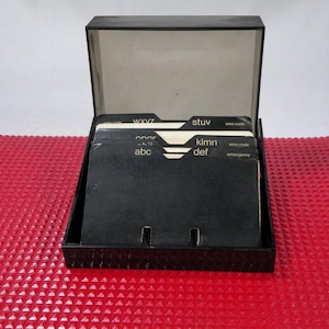 Plastic phonebook with cardboards sheets with smoked grey cover Vintage 1970