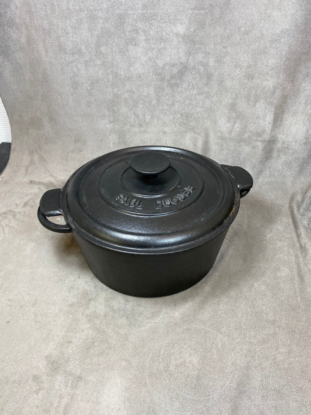 Cocotte NOMAR Paul Bocuse noir en fonte émaillée vintage diamètre 32 cm Vintage made in France