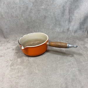 Pot with vintage spout Le Creuset orange enamelled cast iron and wooden handle Vintage made in France 1970