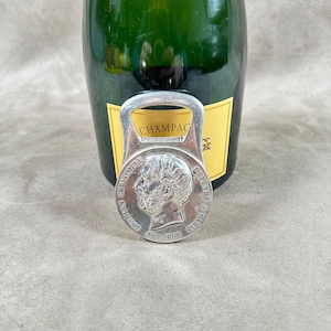RARE Christofle bottle opener in silver metal with head decoration by Charles Christofle Made in France