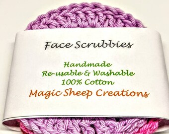 May include: Three handmade face scrubbies made of 100% cotton. The scrubbies are layered in shades of pink, red, and purple. The scrubbies are packaged with a white label that reads "Face Scrubbies, Handmade, Re-usable & Washable, 100% Cotton, Magic Sheep Creations."