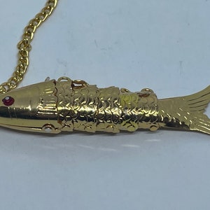 Vintage gilt articulated fish pendant new old stock