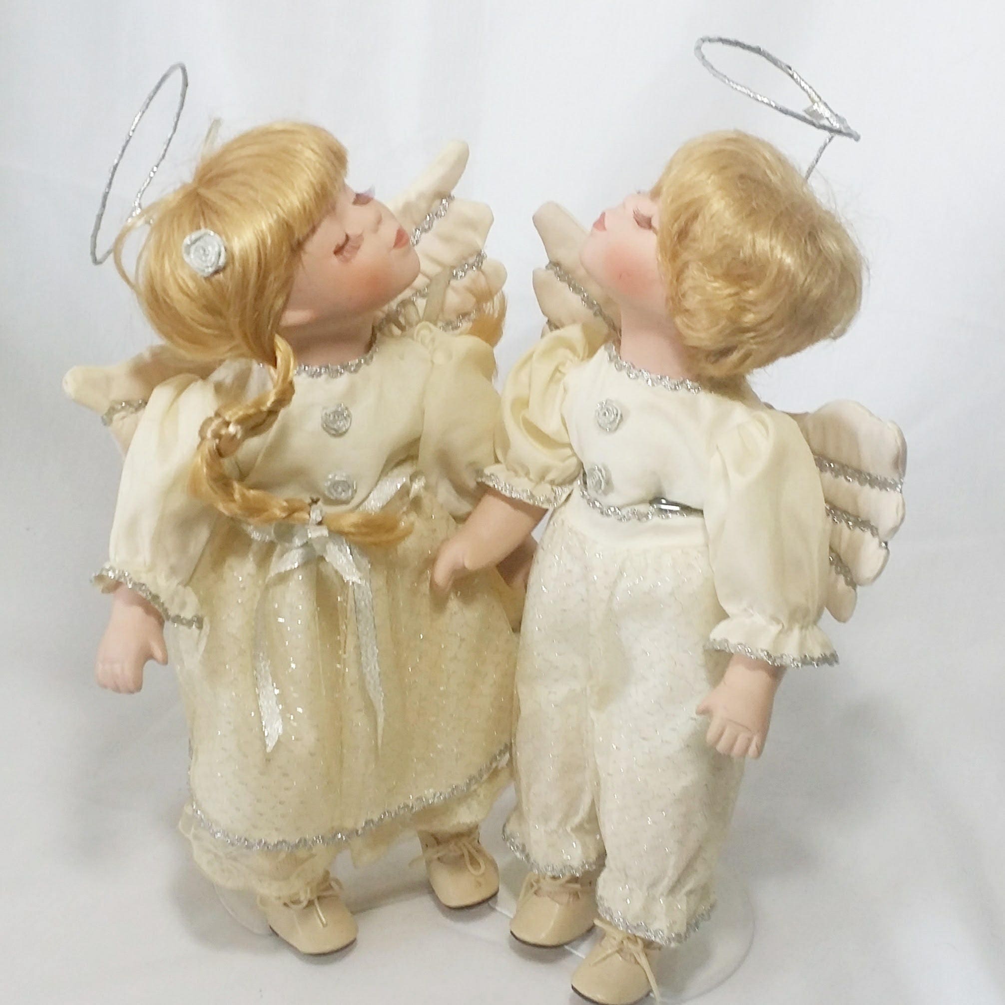 boy and girl kissing porcelain dolls