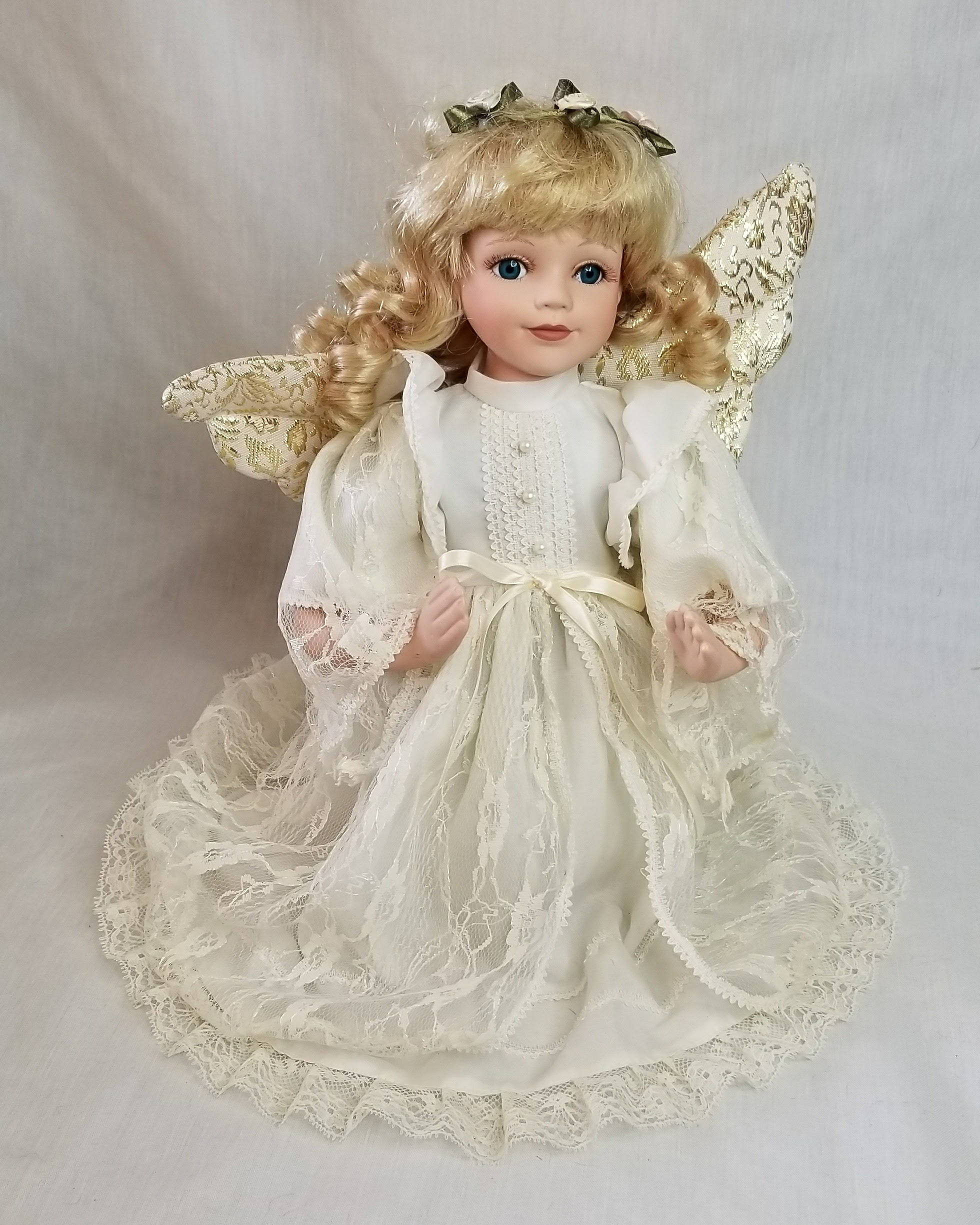 praying porcelain doll