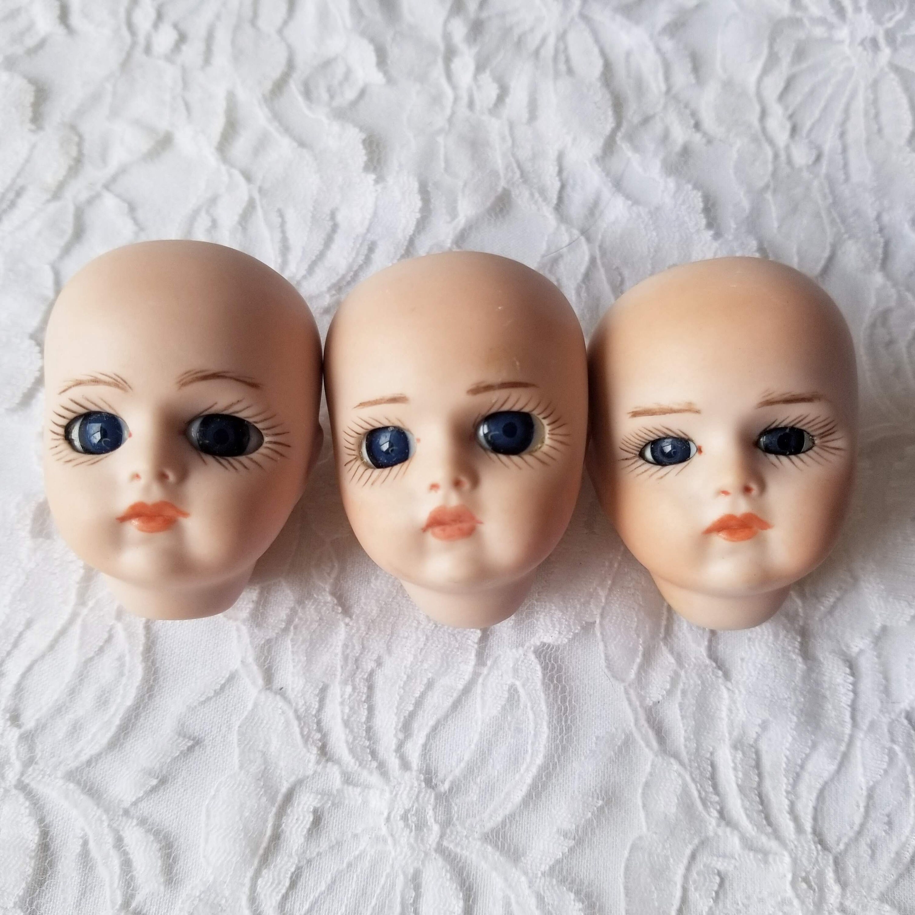 small porcelain doll heads