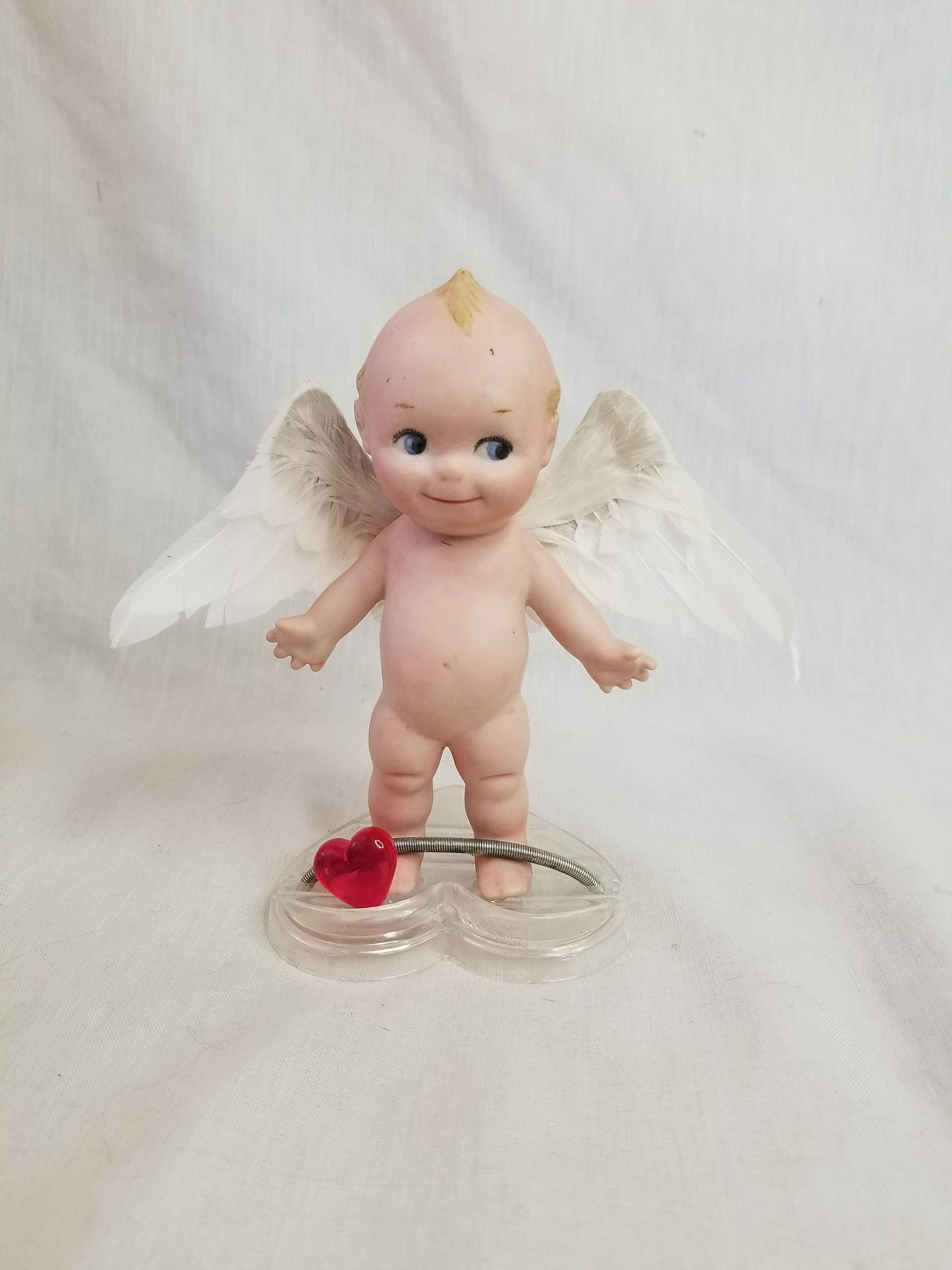 kewpie doll with wings