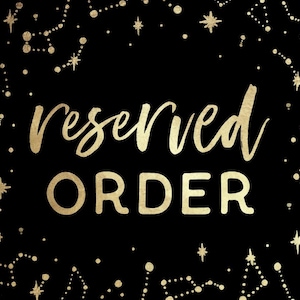 May include: Black background with gold constellation design and the words "reserved ORDER" in gold lettering. The word "reserved" is in a cursive font, and "ORDER" is in a bold, sans-serif font.