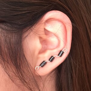 Ear crawlers or climbers, sterling silver wire with black barrel shaped hematite beads.