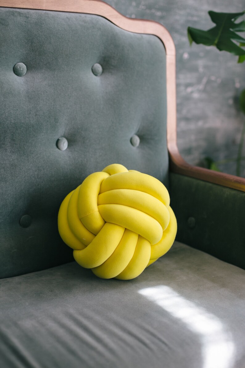 yellow knot pillow