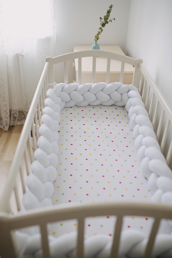 white braided crib bumper