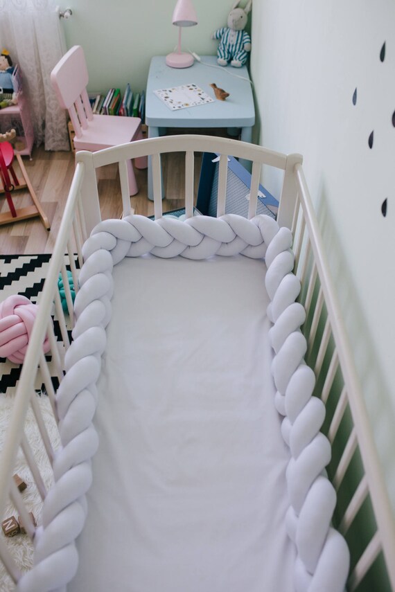 white braided crib bumper