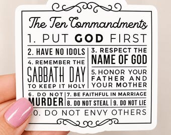May include: A white sticker with a black border and the text "The Ten Commandments." The text includes the commandments: Put God First, Have No Idols, Respect the Name of God, Remember the Sabbath Day, Honor Your Father and Mother.