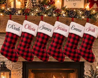 May include: Six Christmas stockings featuring a red and black buffalo plaid pattern with white faux fur cuffs. Each cuff is personalized with the embroidered names Noah, Olivia, James, Jessica, Emma, and Josh in a black cursive script font.