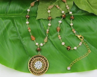 A Hand Beaded Filigree Crystal Medallion Pendant Necklace.