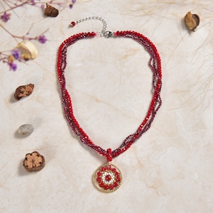 A Hand-beaded Medallion Pendant Necklace; Short Necklace with Pendant.  Garnet Red Necklace. Multi-strand Red Necklace.