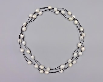44" Long fresh water pearl necklace weaved on a double strand leather cord
