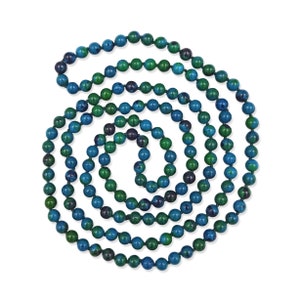 May include: A long strand of blue and green gemstone beads, strung together on a thin cord. The beads are round and have a smooth, polished finish.
