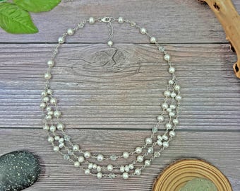 Pearl and crystal multi strand necklace. unique pearl necklace. shimmering pearl and sparkly crystal necklace.