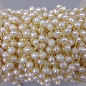 2ft. 4-5mm fresh water pearl potato shaped rosary style beaded chain. wire wrapping chain. premier quality non tarnish gold wire.