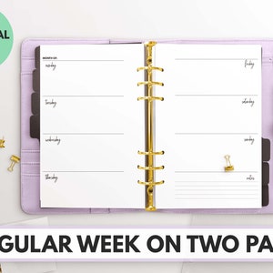 May include: A purple personal wide planner with gold rings. The planner is open to a weekly spread with a space for each day of the week. The text "MONTH OF" and "NOTES" are visible on the page.
