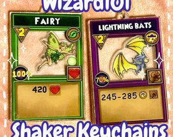 PRE-ORDER Wizard101 Shaker Keychain, Storm Bat and Life Fairy, Gold Star Clasp