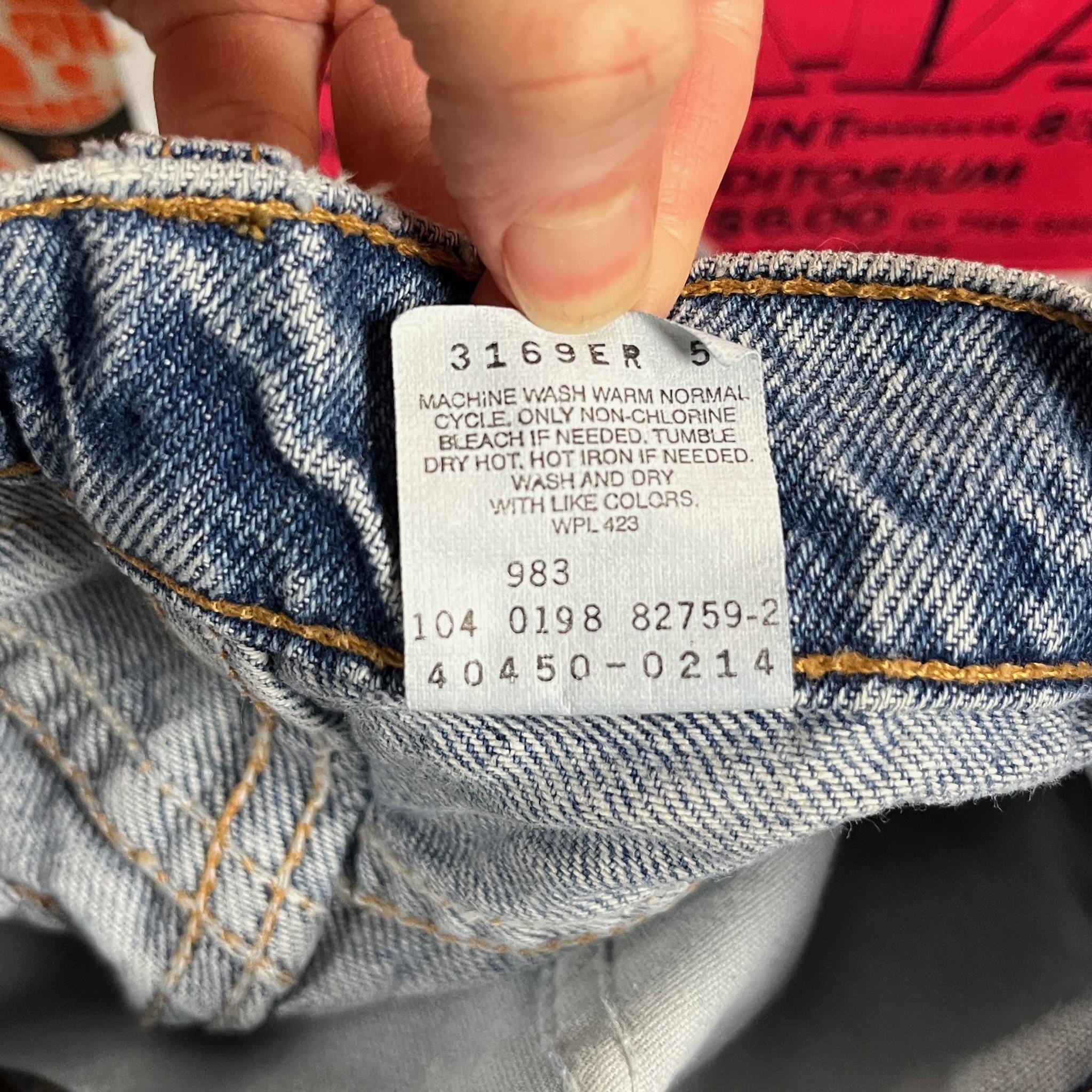Vintage Kids 90s Distressed Light Wash Levi's 550 Orange Tab