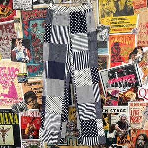May include: Black and white patchwork pants with a variety of patterns, including polka dots, stripes, and checks. The pants are made of a lightweight fabric and have a relaxed fit.