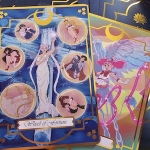 May include: A rectangular tarot card featuring a central figure in a white gown standing before a pillar, surrounded by five circular vignettes of anime characters. The card has a dark blue background with gold borders and the text Wheel of Fortune.