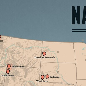May include: A vintage-style map of the USA, featuring orange shield icons marking national park locations. The map has a tan background with blue water. The text "NAT" is visible in the upper right corner. The map includes locations like Yellowstone and Glacier.