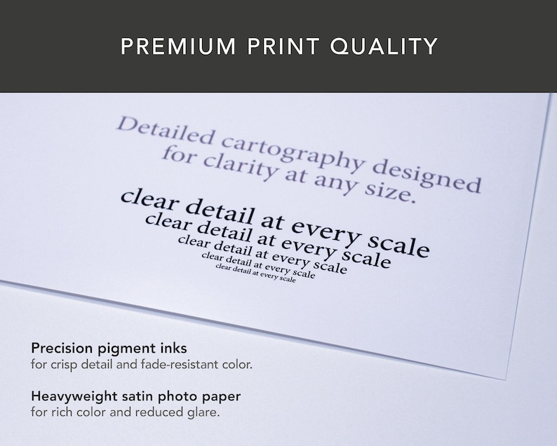 May include: A close-up of a white paper with text that reads "PREMIUM PRINT QUALITY". The text on the paper includes "Detailed cartography designed for clarity at any size" and "clear detail at every scale". The bottom of the paper reads "Precision pigment inks" and "Heavyweight satin photo paper".