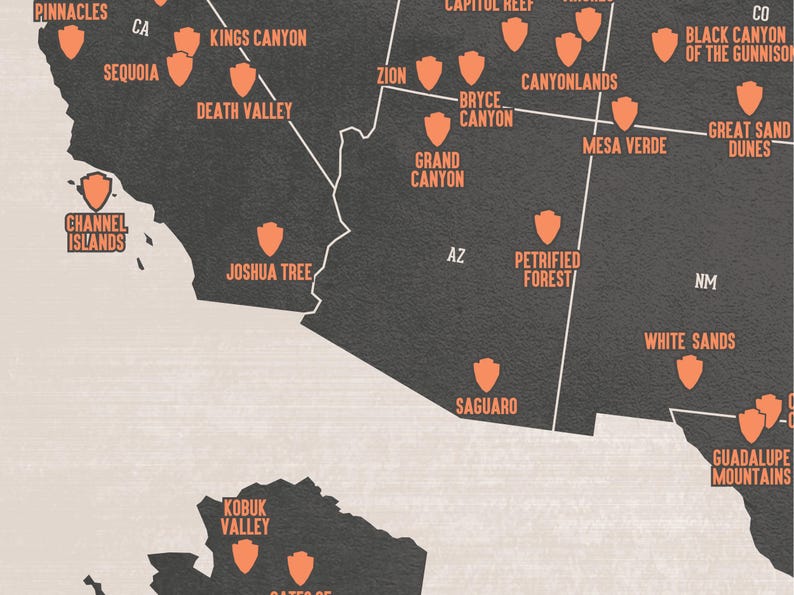 May include: A detailed map of the United States featuring national parks and monuments. The map is in shades of gray with orange icons and text indicating locations like Zion, Grand Canyon, and Death Valley.