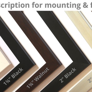 May include: A selection of picture frame samples in various colors and styles. The frames include black, white, walnut, silver, and bronze finishes. The text on the frames indicates the width of the frame.